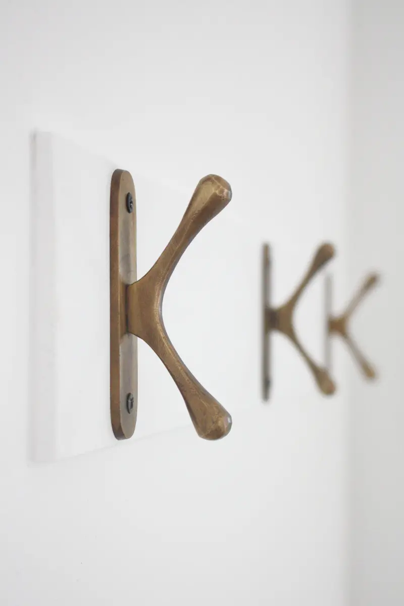 Brass Curved Wall Cleat – Decorative & Functional Mounting Hardware 1
